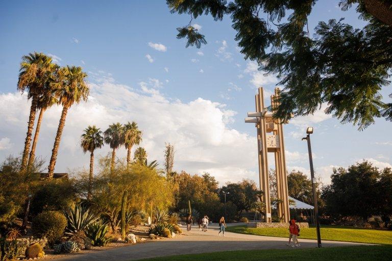 clock tower with students walking outside